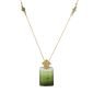 18-karat gold, raw cut green tourmaline (or two-tone) stone, lily/lotus motif, crystal column-shaped luxury necklace.