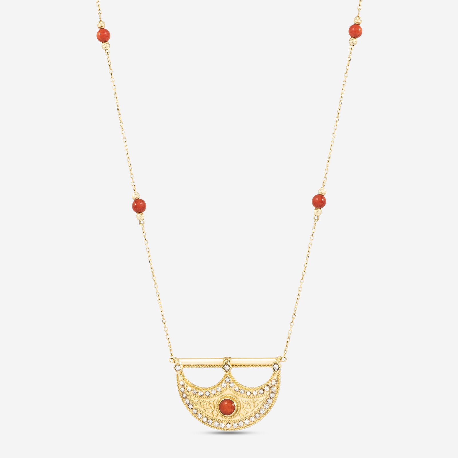 18-karat gold and diamond necklace with a central red stone and a crescent-shaped crown motif.