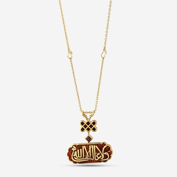 18K Gold Ruby Hat Andalusian Necklace 18-karat gold necklace, featuring calligraphy motifs on a red enamel background, inspired by Andalusian architecture, with ruby stone details.