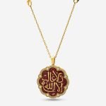 18-karat gold and diamond-framed, ruby-red enameled, round seal-shaped luxury necklace with calligraphy motifs.