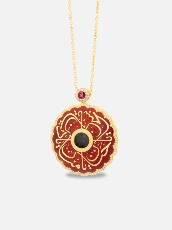 18-karat gold necklace in the shape of a lamp with ruby stones featuring a Kaaba cover motif