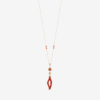 Necklace design featuring an 18-karat gold chain with a coral cabochon surrounded by diamond stones, and a natural red coral branch pendant with an open center and teardrop shape hanging below.
